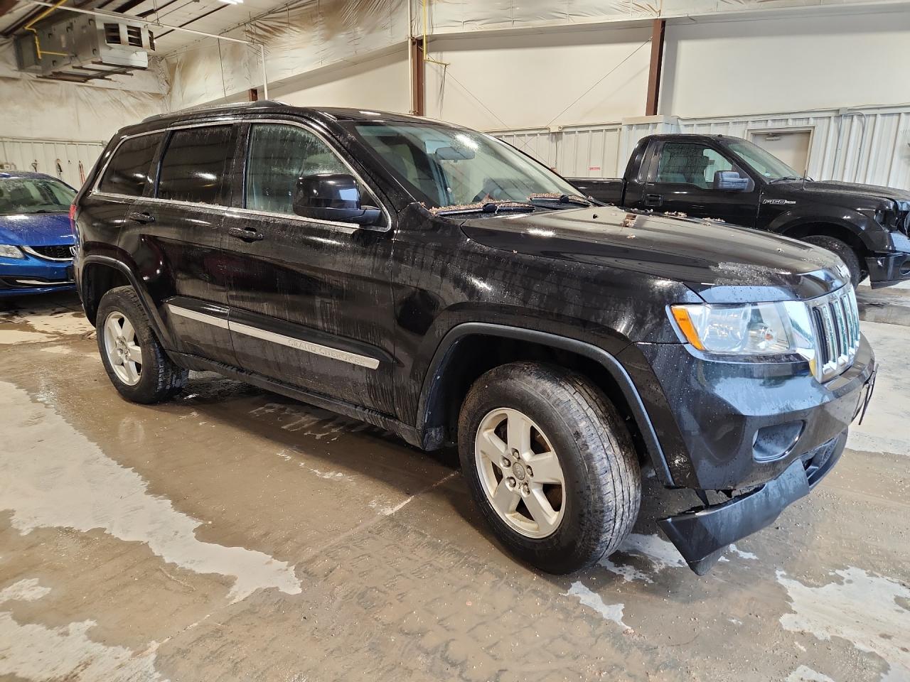 2013 Jeep Grand Cherokee Laredo Black vin: 1C4RJFAG8DC508403 Damage: Front Bumper Molding, Broken, Replacement Required