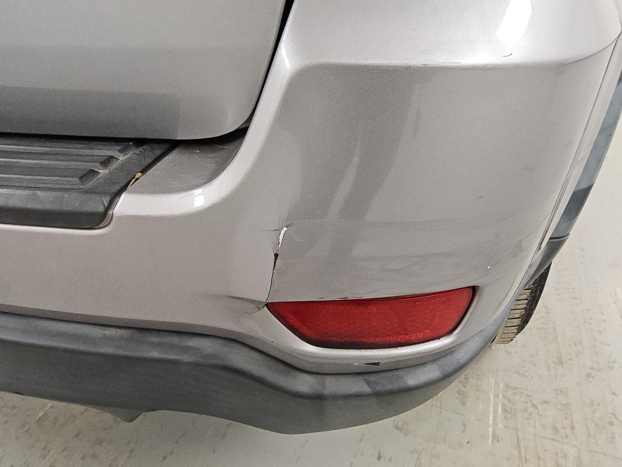 2014 Jeep Grand Cherokee Laredo Silver vin: 1C4RJFAG9EC310611 Damage: Rear Bumper, Broken, Replacement Required