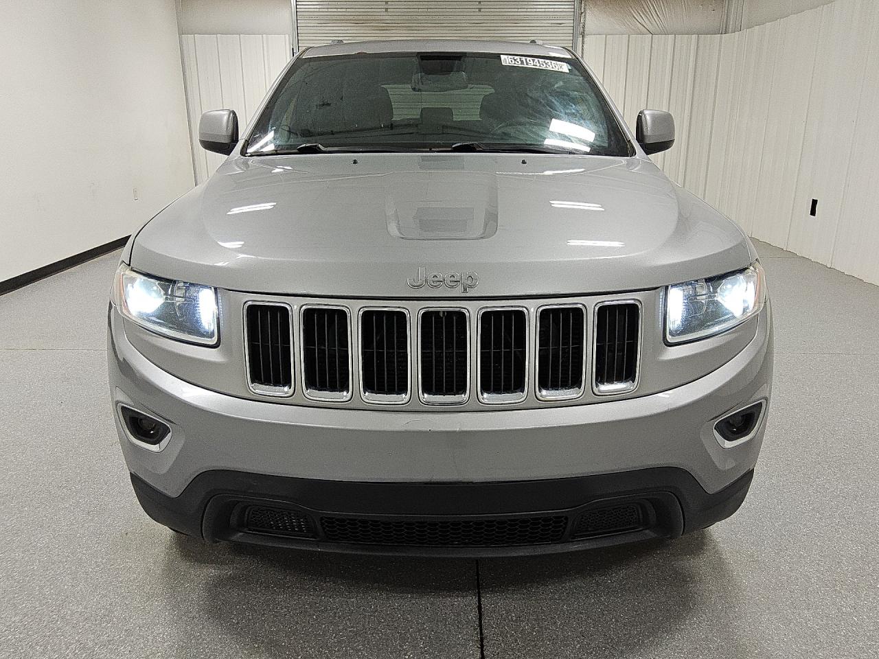 2015 Jeep Grand Cherokee Laredo Silver vin: 1C4RJFAG9FC913186 Damage: Left Headlamp Bulb, Aftermarket, Replacement Required