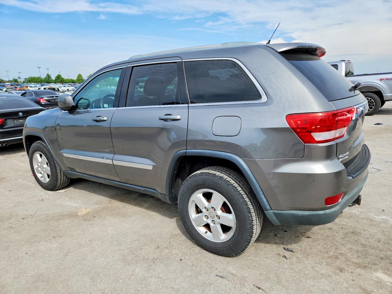 2012 Jeep Grand Cherokee Tan vin: 1C4RJFAGXCC250609