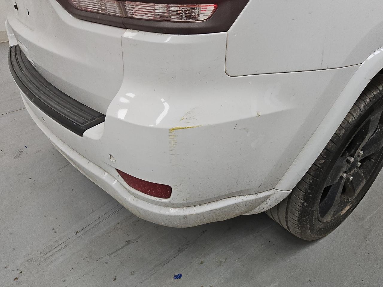 2015 Jeep Grand Cherokee Laredo White vin: 1C4RJFAGXFC786285 Damage: Rear Bumper, Heavy Scratch, 1 To 2 Inches