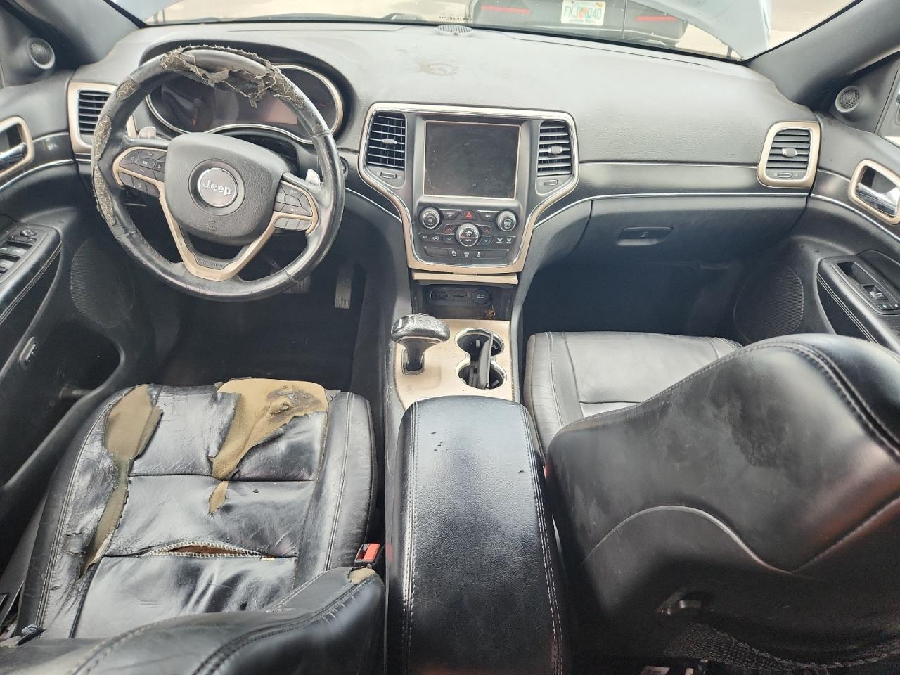 2014 Jeep Grand Cherokee Limited Black vin: 1C4RJFBT0EC226995 Damage: Front Center Armrest, Torn, 1/8 To 1/2 Inch