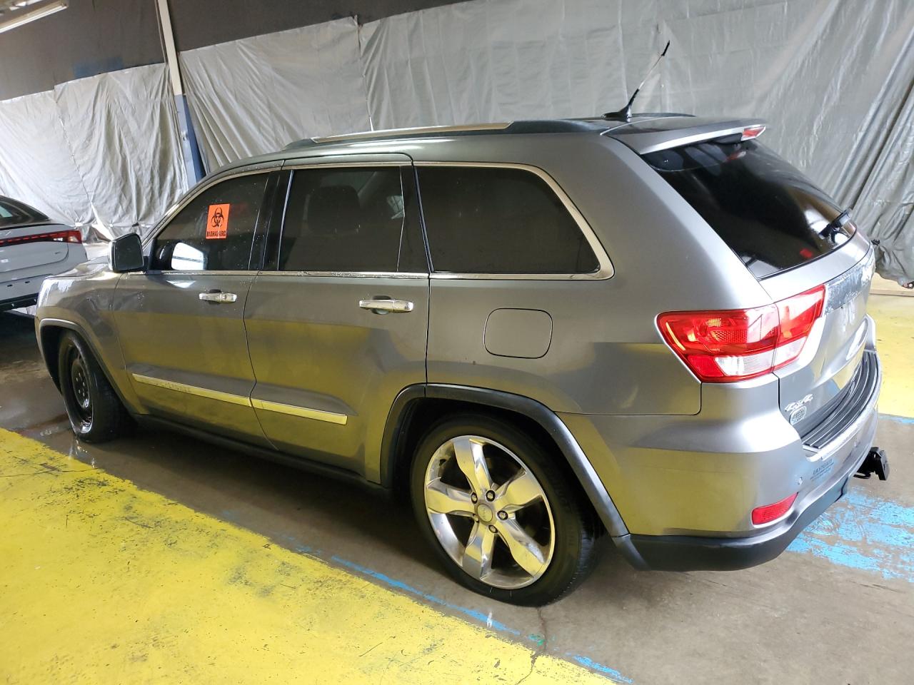 2012 Jeep Grand Cherokee Overland Gray vin: 1C4RJFCG8CC169329 Damage: Left Rear Tire, Worn, Replacement Required