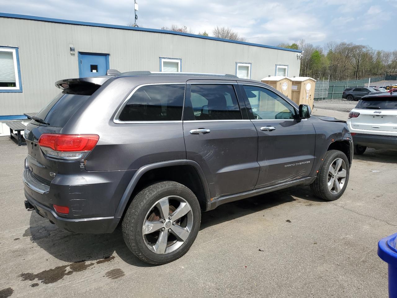 2014 Jeep Grand Cherokee Overland Gray vin: 1C4RJFCG9EC535852 Damage: Right Tail Light, Heavy Scratch, Replacement Required