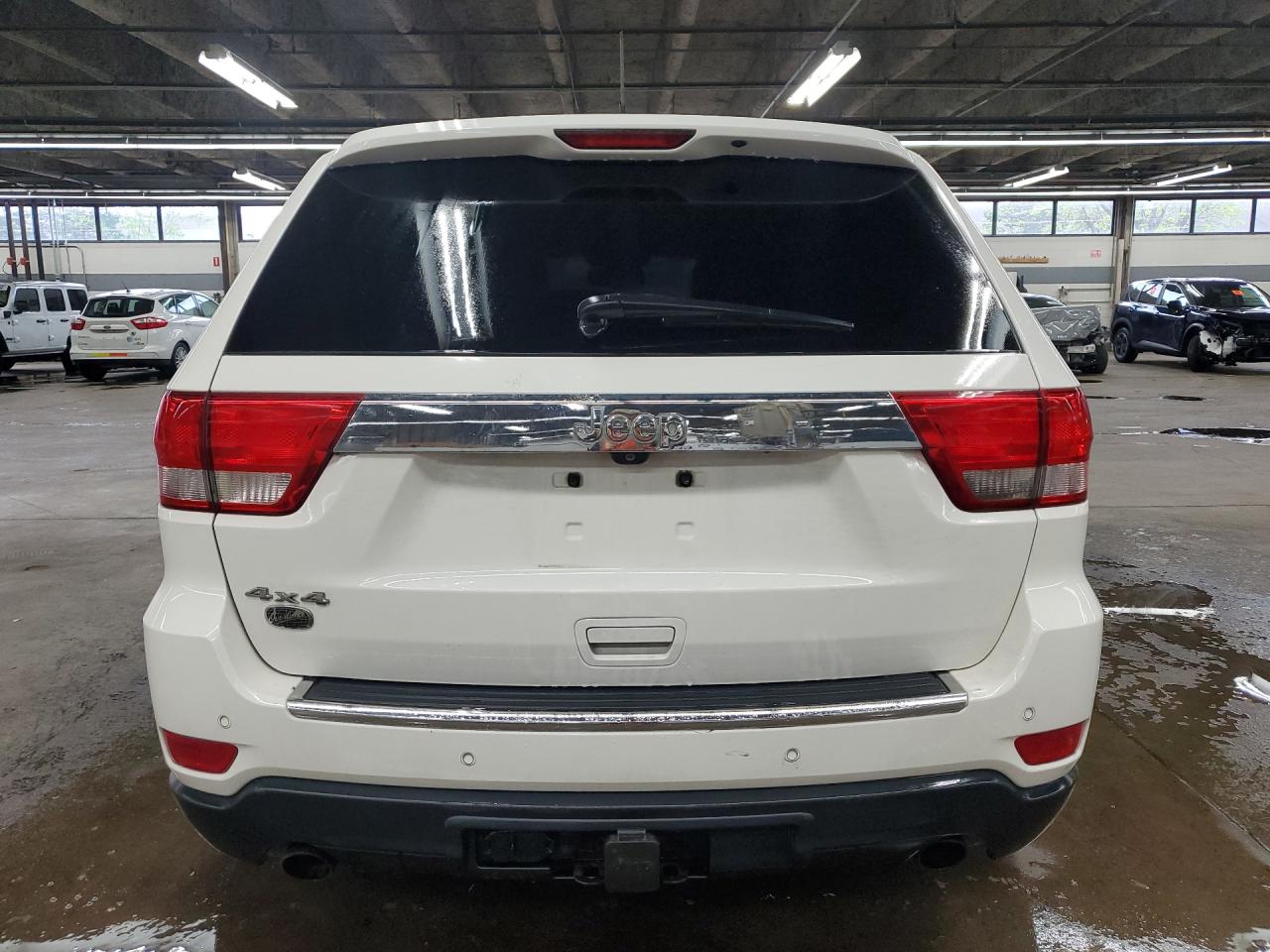 2012 Jeep Grand Cherokee Overland White vin: 1C4RJFCT5CC250754 Damage: Rear Bumper, Heavy Scratch, 1/2 To 1 Inch