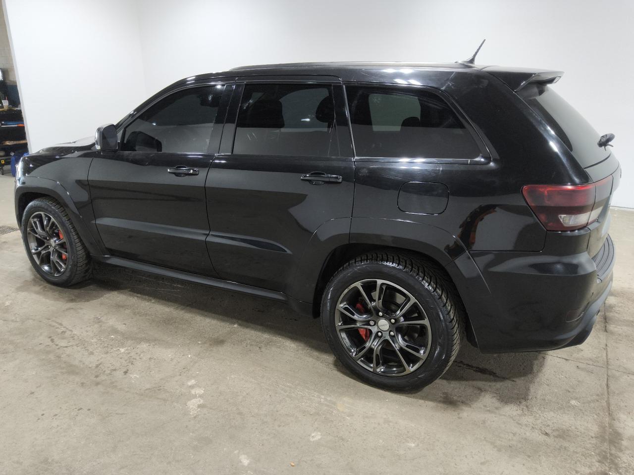 2012 Jeep Grand Cherokee Srt-8 Black vin: 1C4RJFDJ1CC289063 Damage: Left Tail Light, Aftermarket, Acceptable