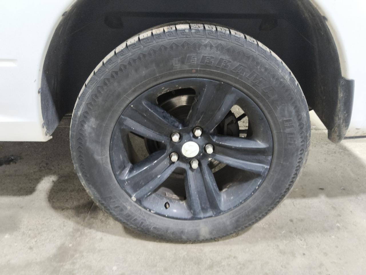 2015 Ram 1500 Sport White vin: 1C6RR6HT5FS661025 Damage: Left Rear Wheel, Chipped, 2