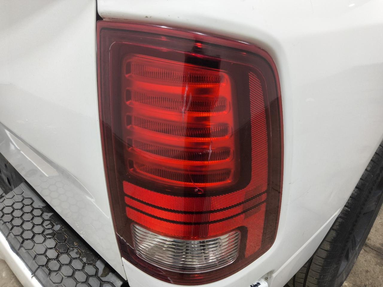 2015 Ram 1500 Sport White vin: 1C6RR6HT5FS661025 Damage: Right Tail Light, Cracked, Replacement Required