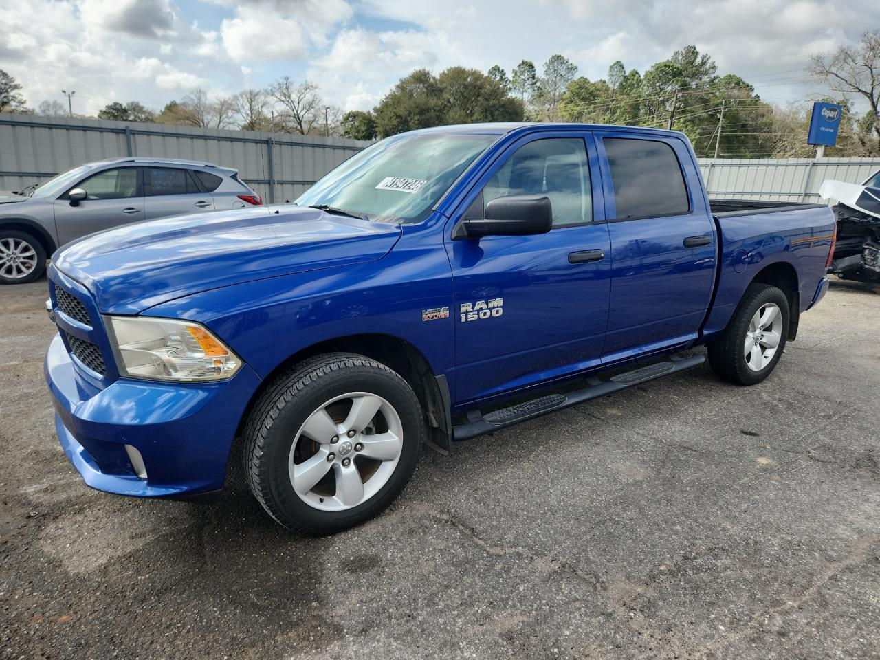 2014 Ram 1500 St Blue vin: 1C6RR6KT2ES377780 Damage: Left Running Board, Aftermarket, Acceptable