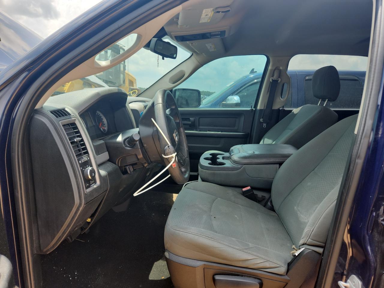 2015 Ram 1500 St Blue vin: 1C6RR6KT7FS592069 Damage: Left Front Seat, Burn Hole, 1/8 To 1/2 Inch