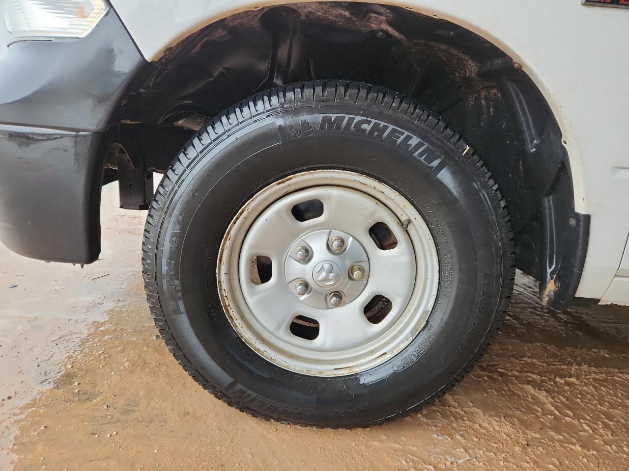 2014 Ram 1500 St White vin: 1C6RR7FTXES323031 Damage: Left Front Wheel, Corrosion, > 12 Inches