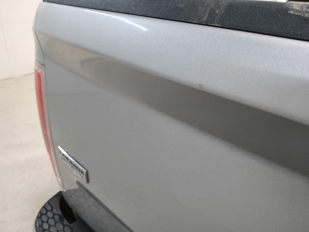 2017 Ram 1500 Laramie Silver vin: 1C6RR7NT8HS507888 Damage: Tailgate, Heavy Scratch, 1 To 2 Inches