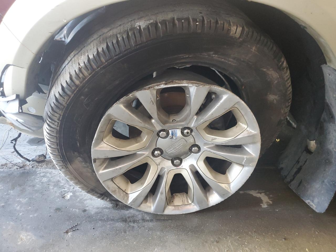 2014 Ram 1500 Longhorn Burgundy vin: 1C6RR7PT2ES346981 Damage: Left Front Wheel, Broken, Replacement Required