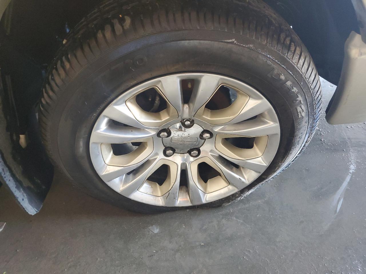 2014 Ram 1500 Longhorn Burgundy vin: 1C6RR7PT2ES346981 Damage: Right Front Tire, Cut, Replacement Required