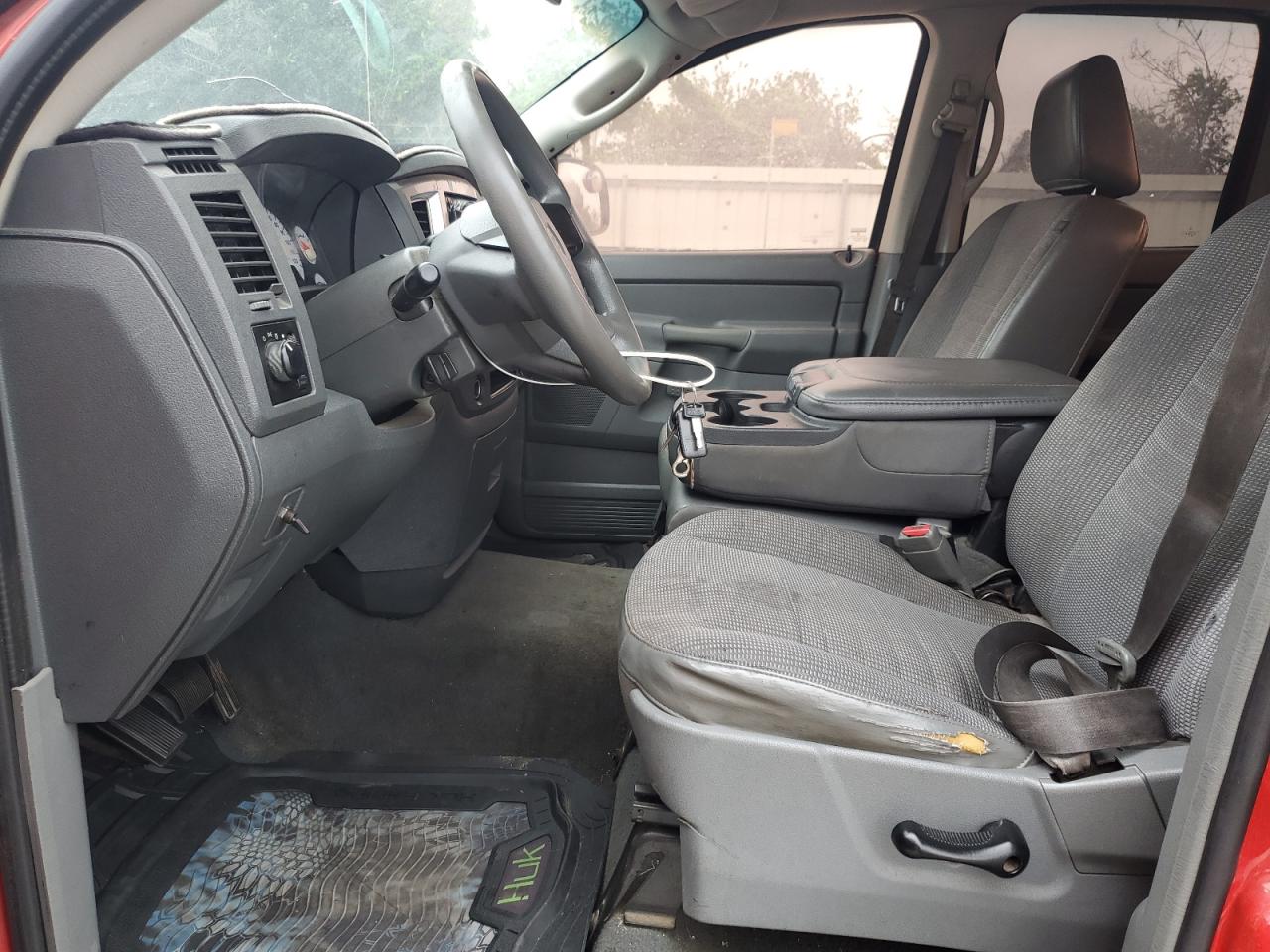 2007 Dodge Ram 1500 St Red vin: 1D7HU18P47S136330 Damage: Left Front Seat, Torn, 1 To 2 Inches