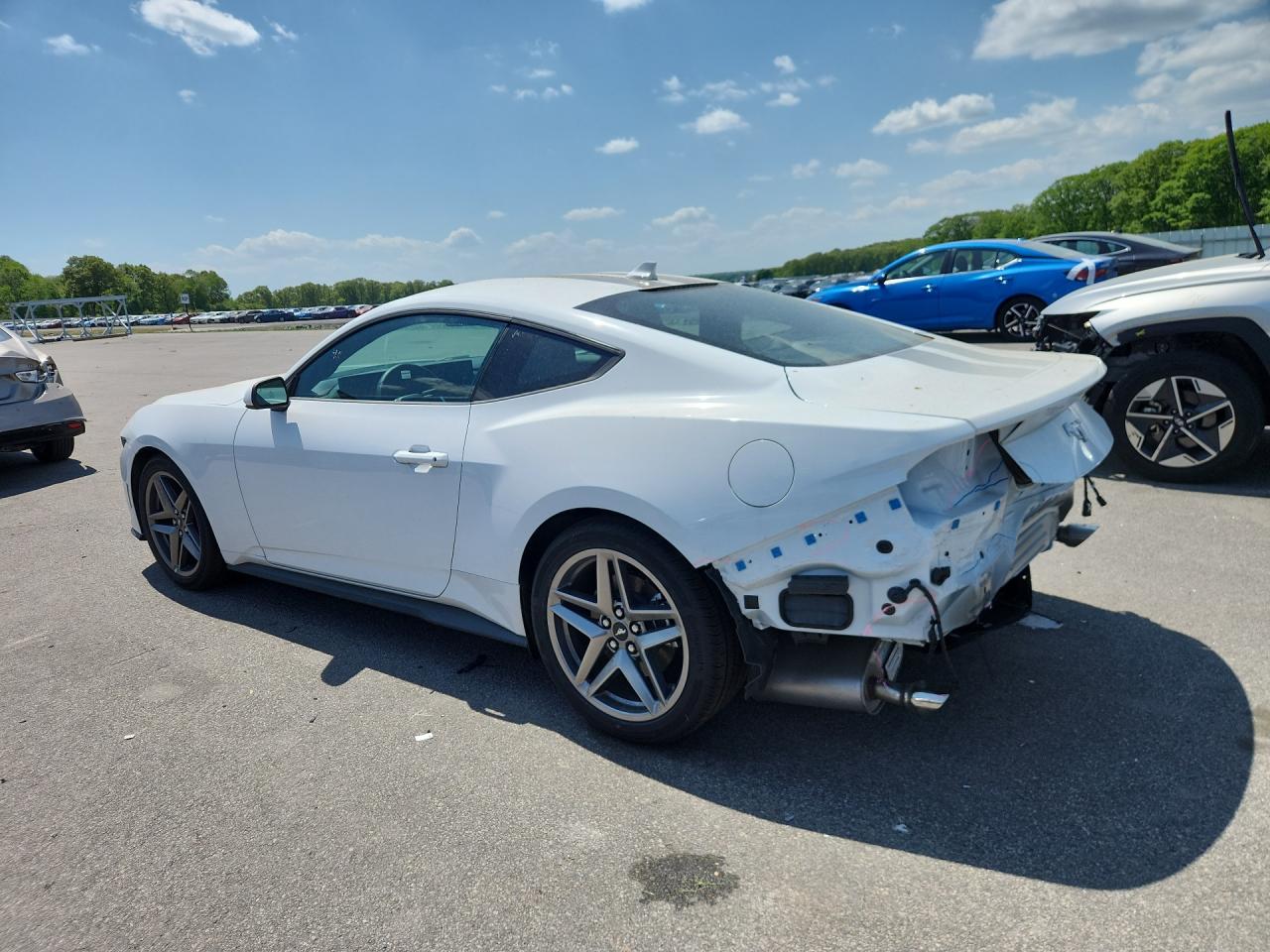 2026 Ford Mustang White vin: 1FA6P8TH3T5117669 Damage: Deck Lid, Dent(S) W/ Paint Dmg, 1/2 To 1 Inch