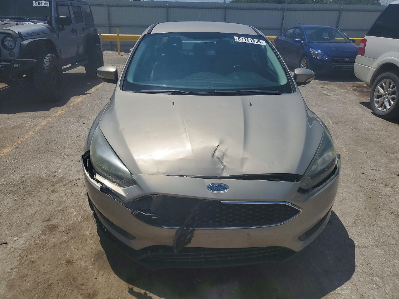 2015 Ford Focus Se Tan vin: 1FADP3F24FL255545