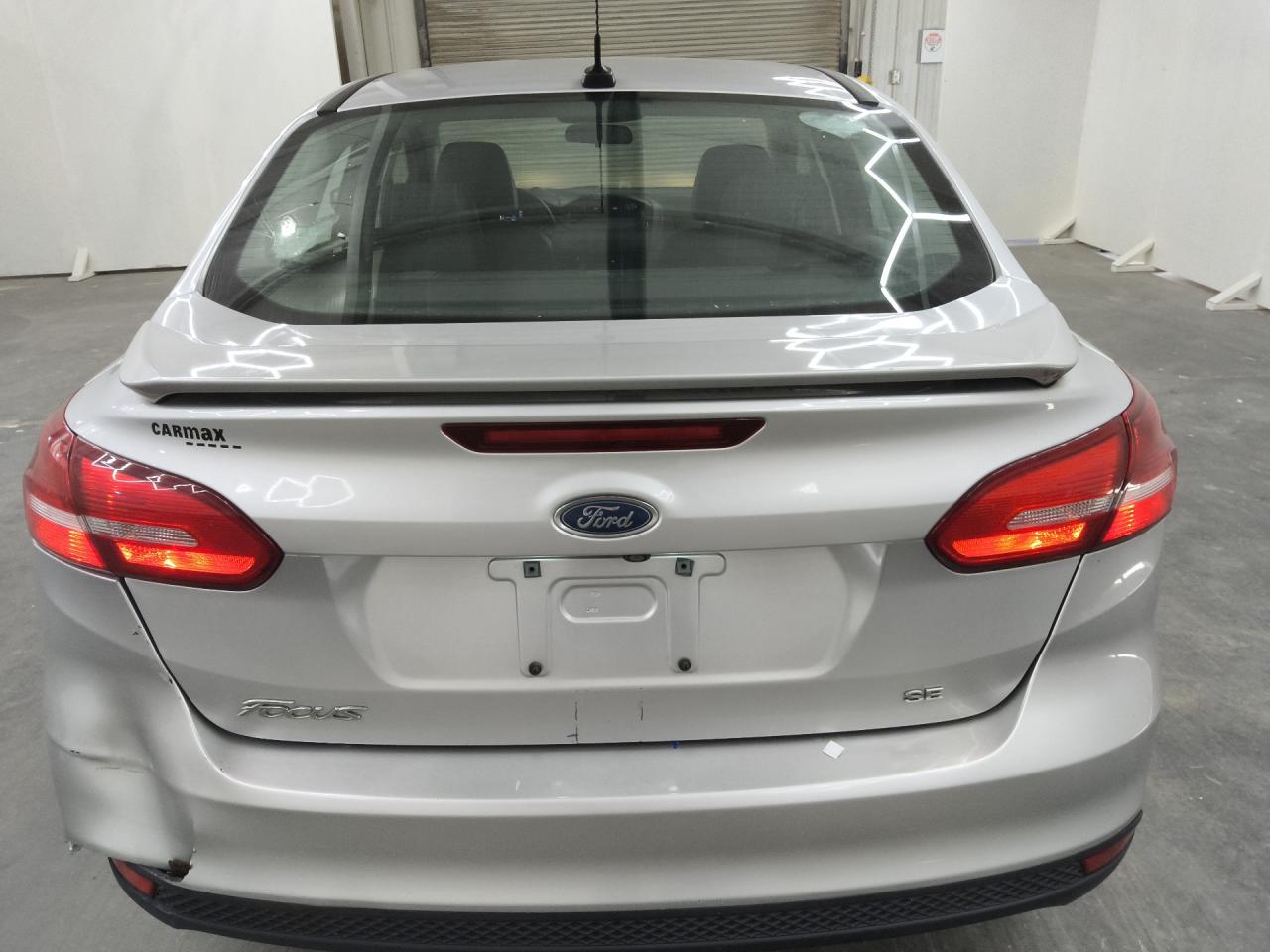 2015 Ford Focus Se Silver vin: 1FADP3F28FL318596 Damage: Deck Lid, Heavy Scratch, 3 To 4 Inches