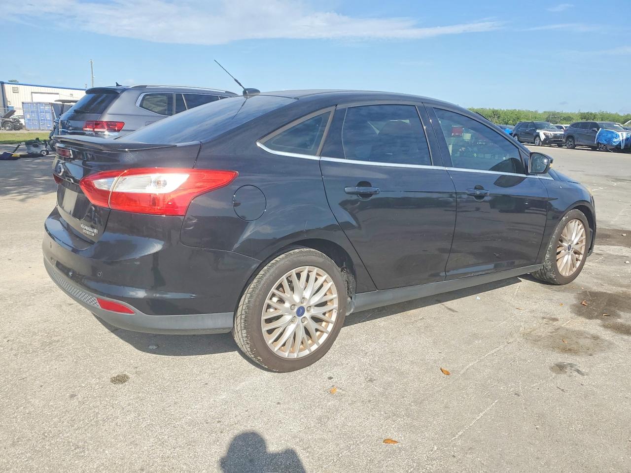 2013 Ford Focus Titanium Black vin: 1FADP3J21DL300073