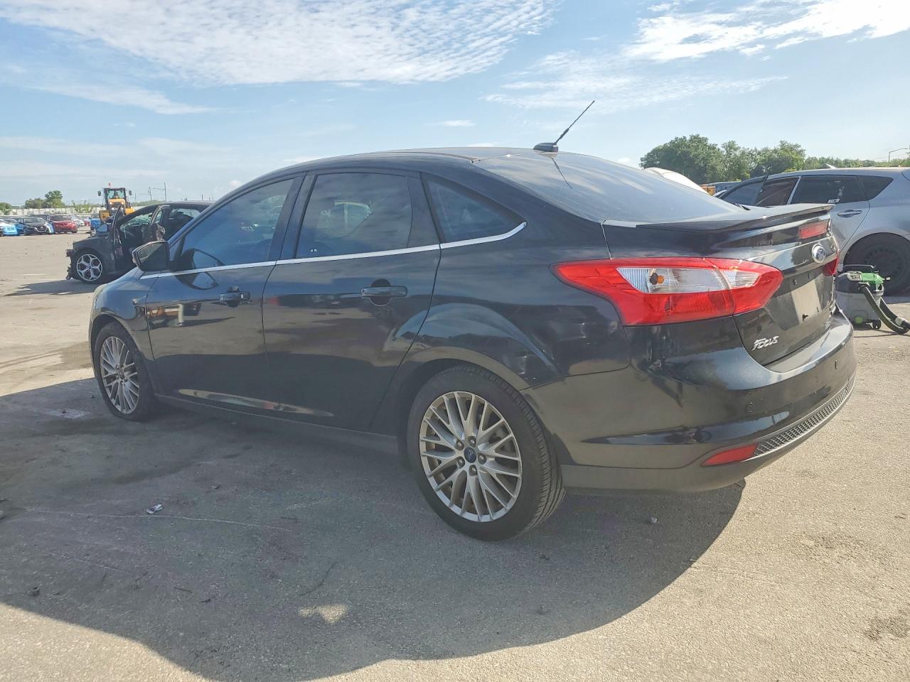 2013 Ford Focus Titanium Black vin: 1FADP3J21DL300073