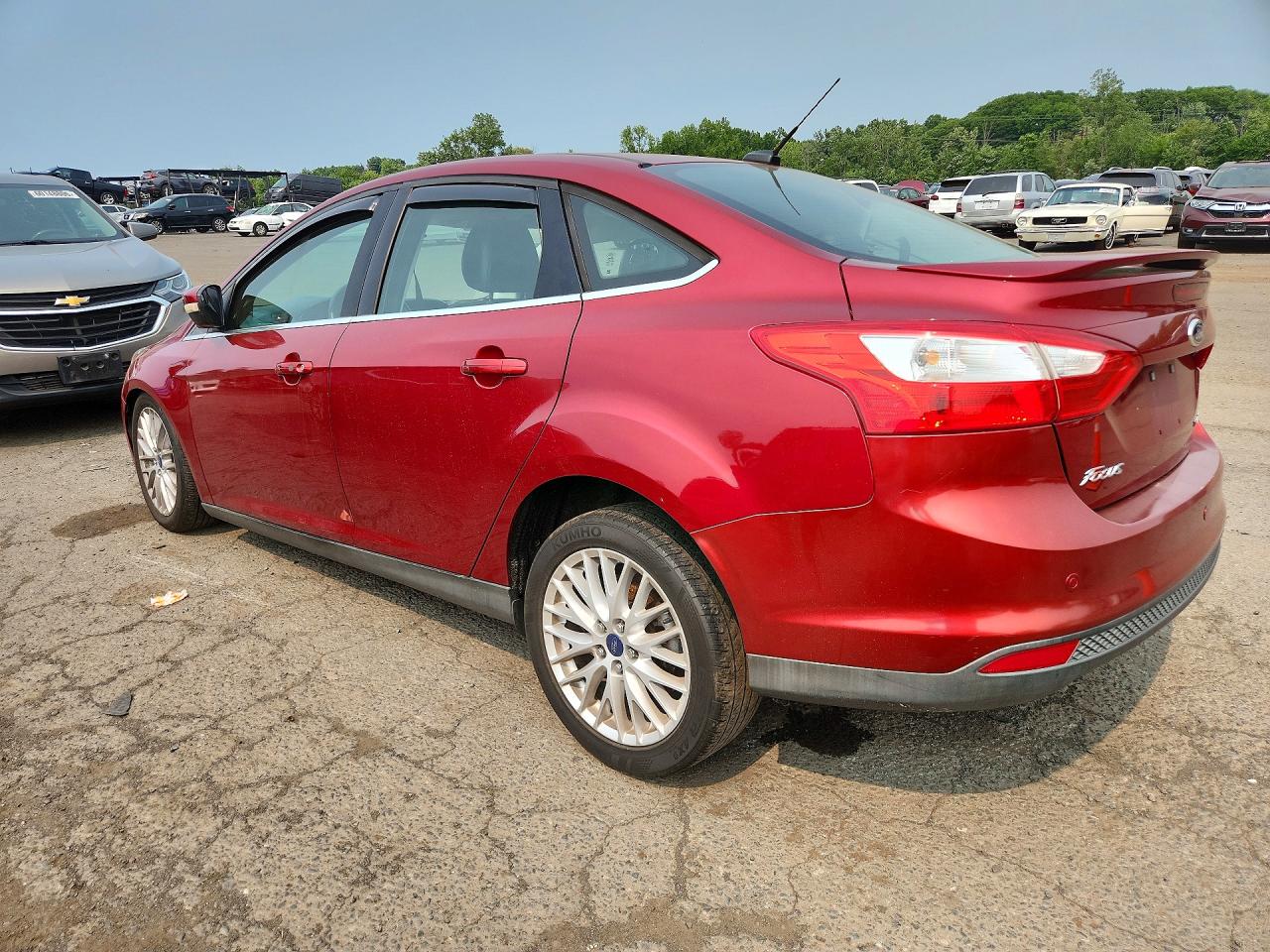 2014 Ford Focus Titanium Red vin: 1FADP3J23EL274299