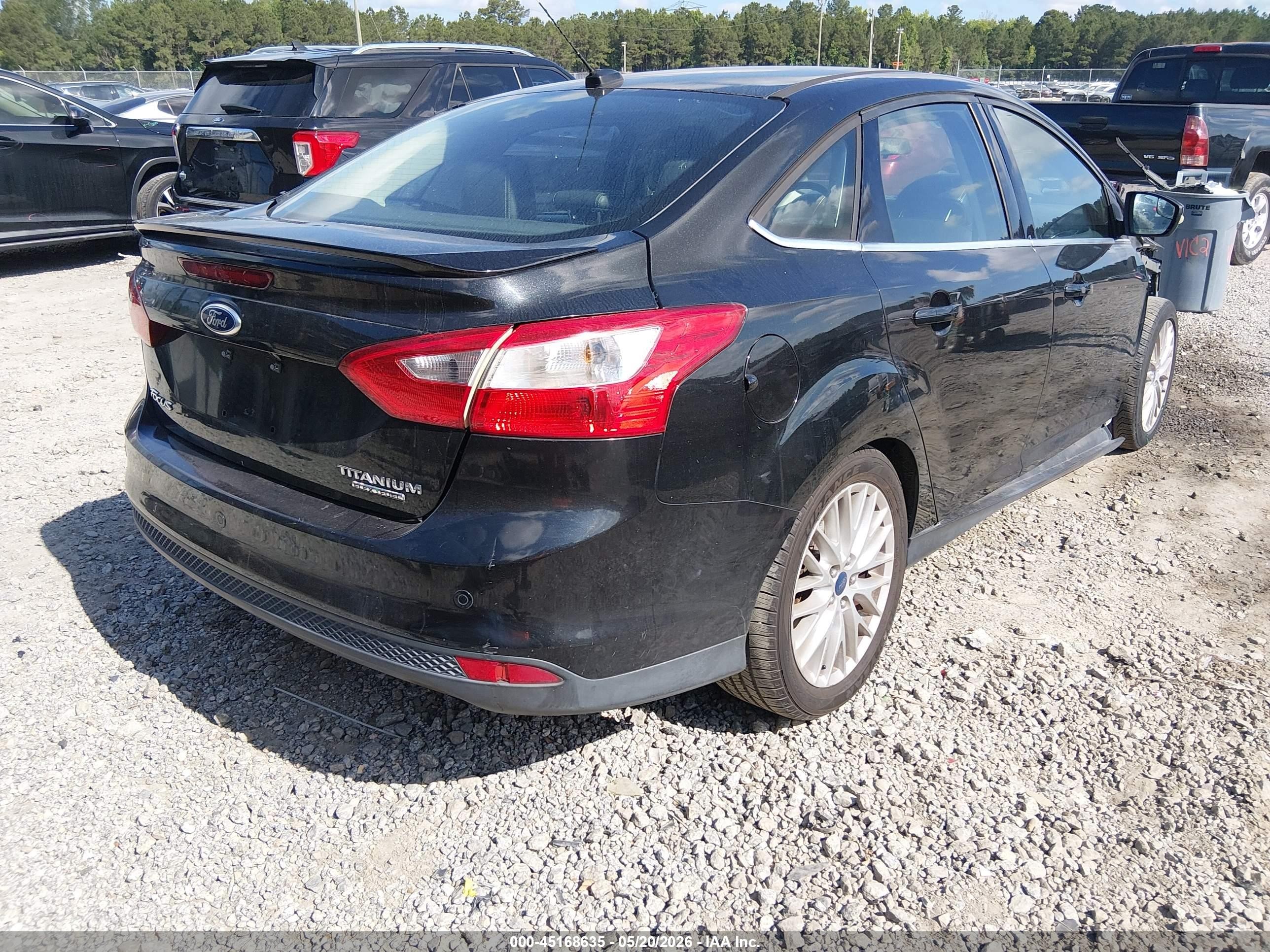 2014 Ford Focus Titanium Black vin: 1FADP3J24EL447456