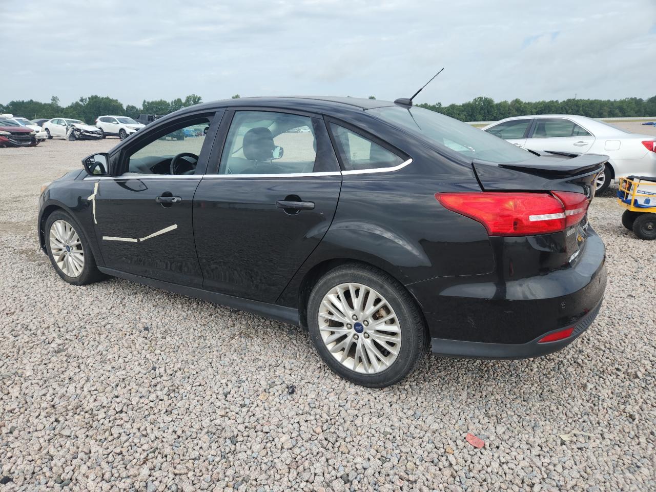 2015 Ford Focus Titanium Black vin: 1FADP3J25FL238230