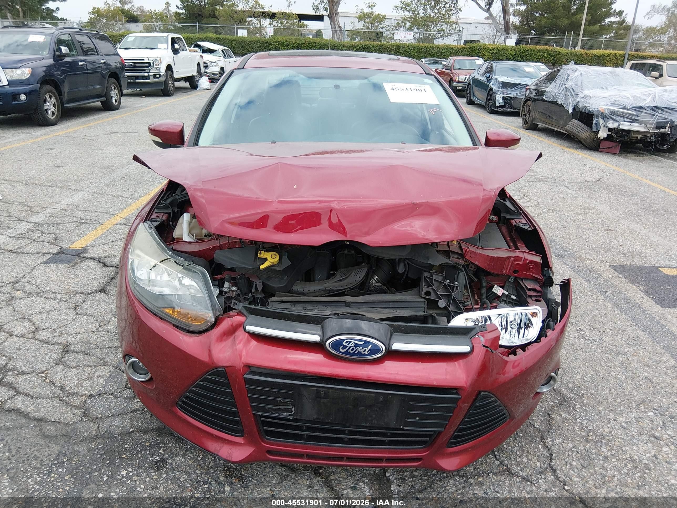 2014 Ford Focus Titanium Red vin: 1FADP3J27EL300435