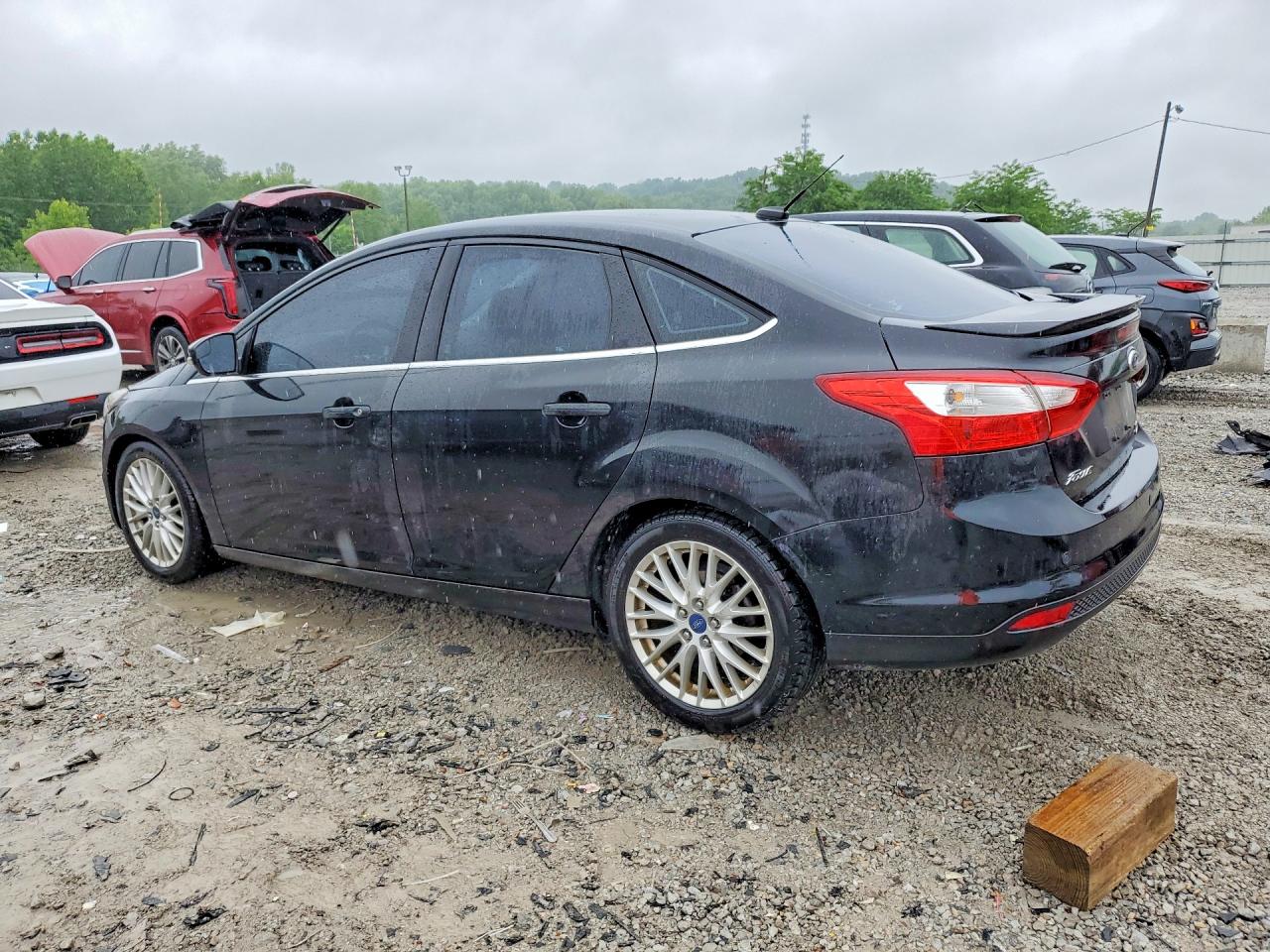 2014 Ford Focus Titanium Black vin: 1FADP3J28EL128870