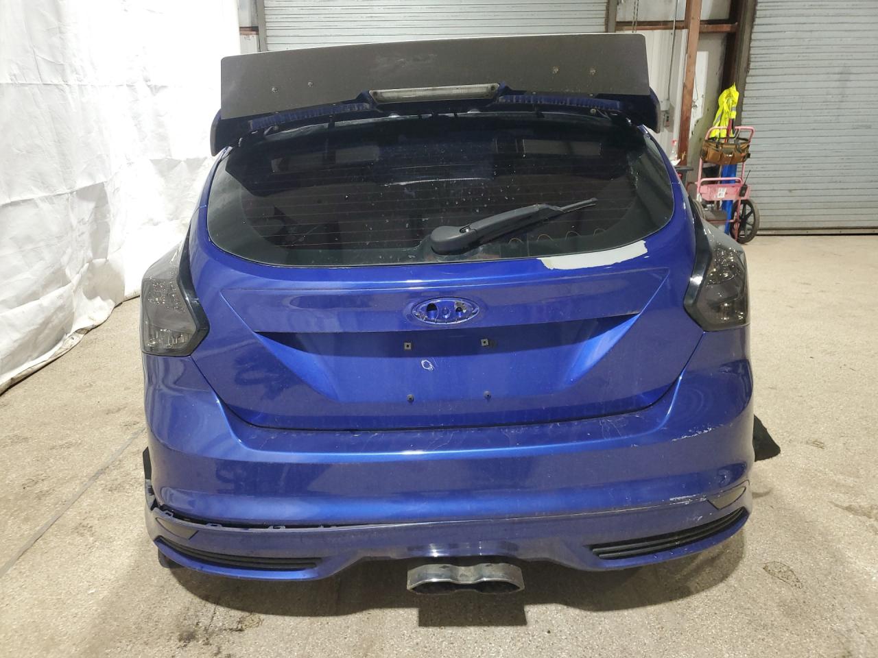 2013 Ford Focus St Blue vin: 1FADP3L94DL196799 Damage: Lift Gate, Peeling, 9 To 10 Inches
