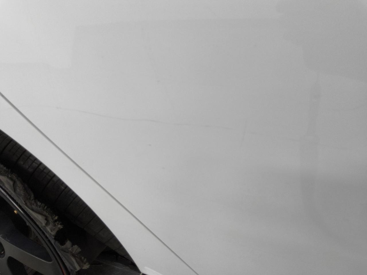 2014 Ford Focus St White vin: 1FADP3L94EL259806 Damage: Right Rear Door, Light Scratch, > 12 Inches