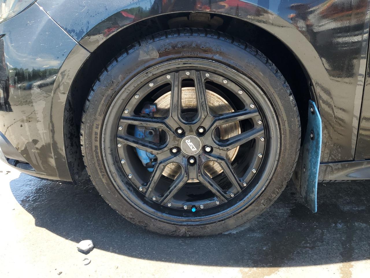 2014 Ford Focus St Black vin: 1FADP3L96EL204399 Damage: Left Front Wheel, Aftermarket, Replacement Required