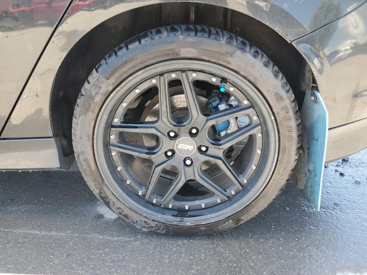 2014 Ford Focus St Black vin: 1FADP3L96EL204399 Damage: Left Rear Wheel, Aftermarket, Acceptable