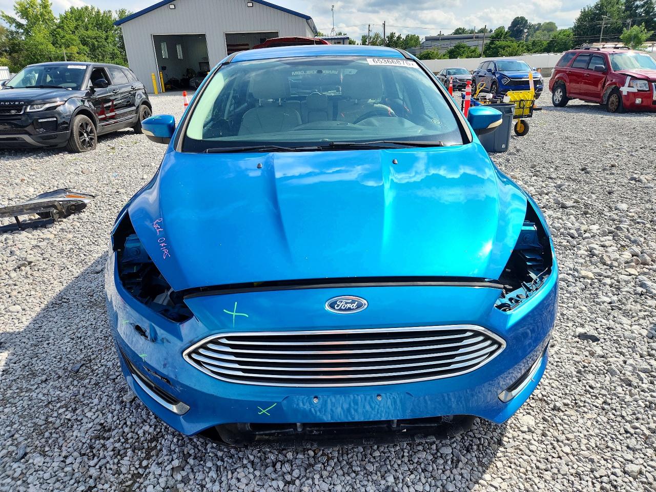 2015 Ford Focus Titanium Blue vin: 1FADP3N20FL386604