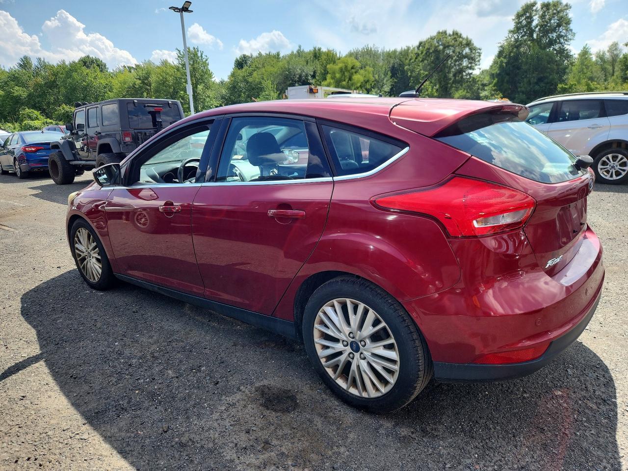 2015 Ford Focus Titanium Red vin: 1FADP3N23FL227091