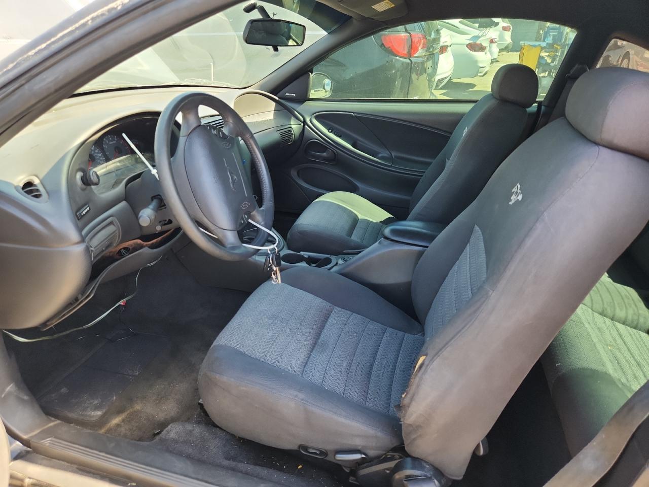 2000 Ford Mustang Gt Black vin: 1FAFP42X8YF193780 Damage: Left Front Seat Back, Torn, > 12 Inches