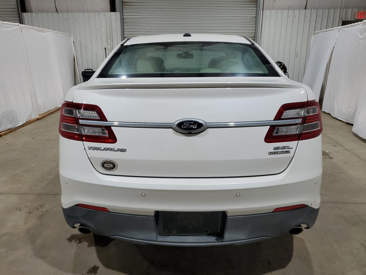 2015 Ford Taurus Sel White vin: 1FAHP2E89FG100533 Damage: Rear Bumper, Heavy Scratch, 1 To 2 Inches