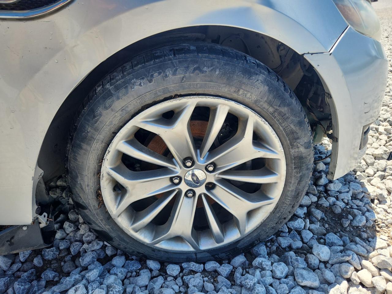 2013 Ford Taurus Silver vin: 1FAHP2F80DG200645 Damage: Right Front Wheel, Curb Rash, > 12 Inches