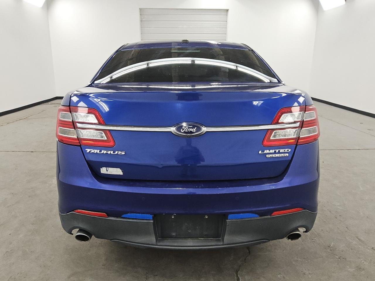 2013 Ford Taurus Limited Blue vin: 1FAHP2F87DG200268 Damage: Rear Bumper, Heavy Scratch, > 12 Inches