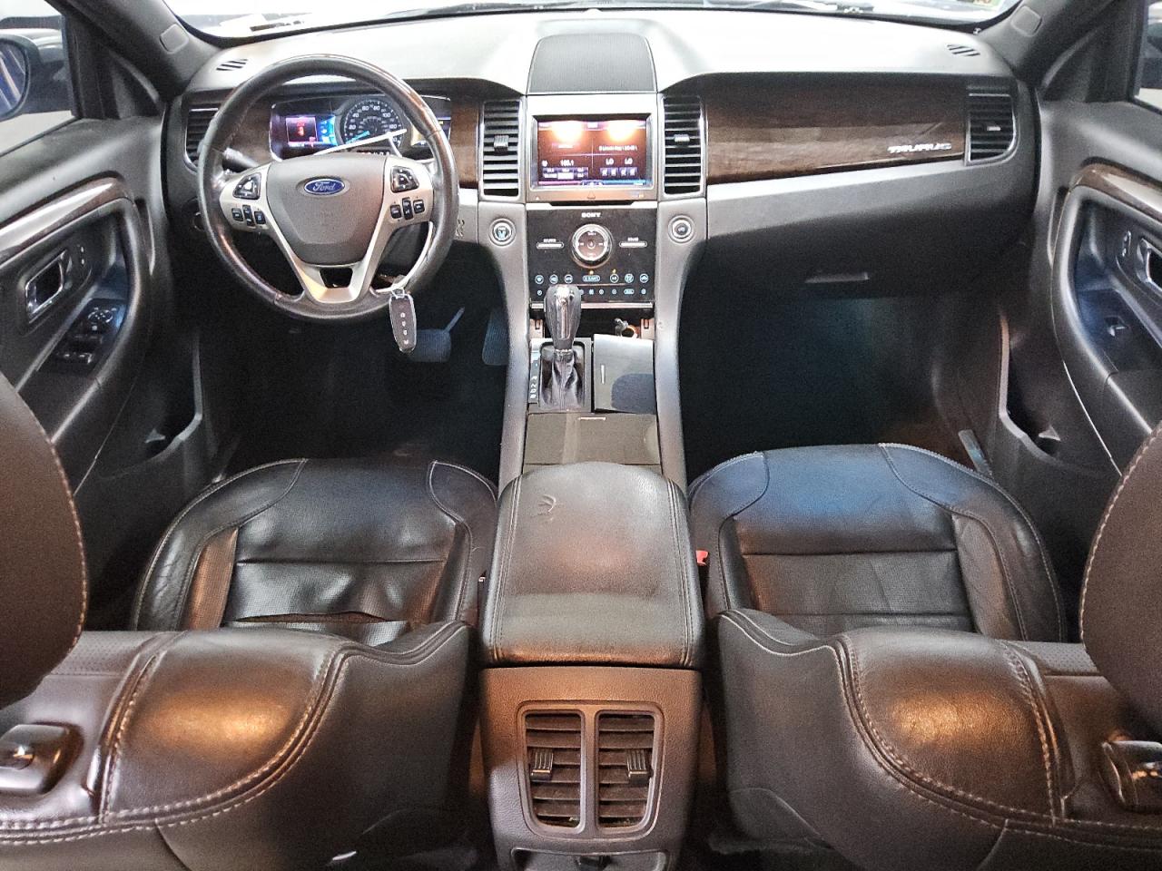 2013 Ford Taurus Limited Blue vin: 1FAHP2F87DG200268 Damage: Console Cover, Torn, 4 To 5 Inches