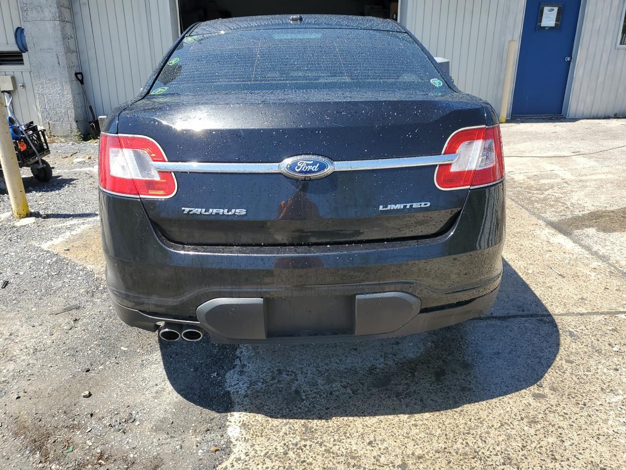 2011 Ford Taurus Limited Black vin: 1FAHP2FW1BG140385 Damage: Rear Bumper, Multiple Scratches Heavy, 2