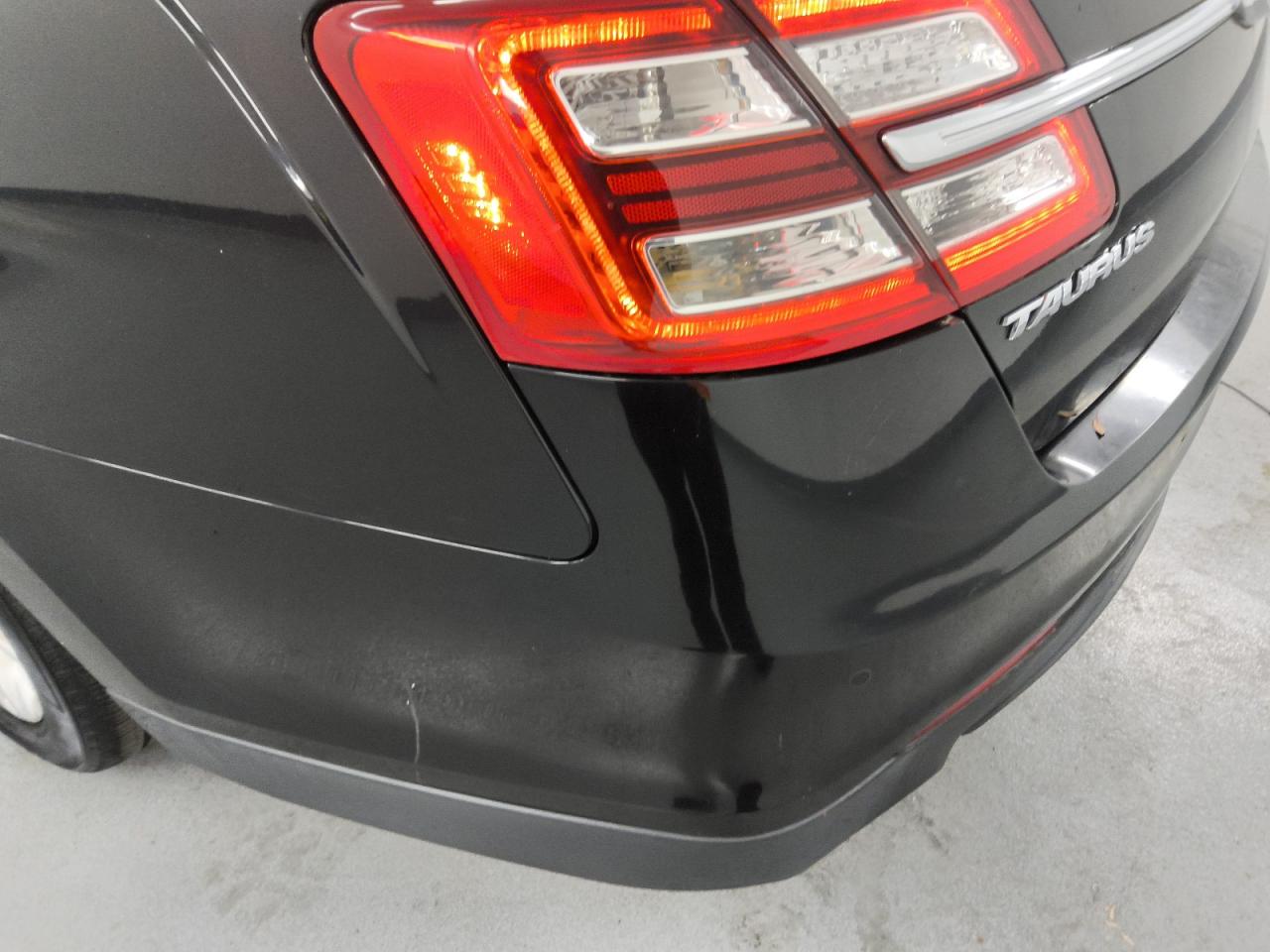 2017 Ford Taurus Sel Black vin: 1FAHP2H82HG126292 Damage: Rear Bumper, Heavy Scratch, 1/2 To 1 Inch