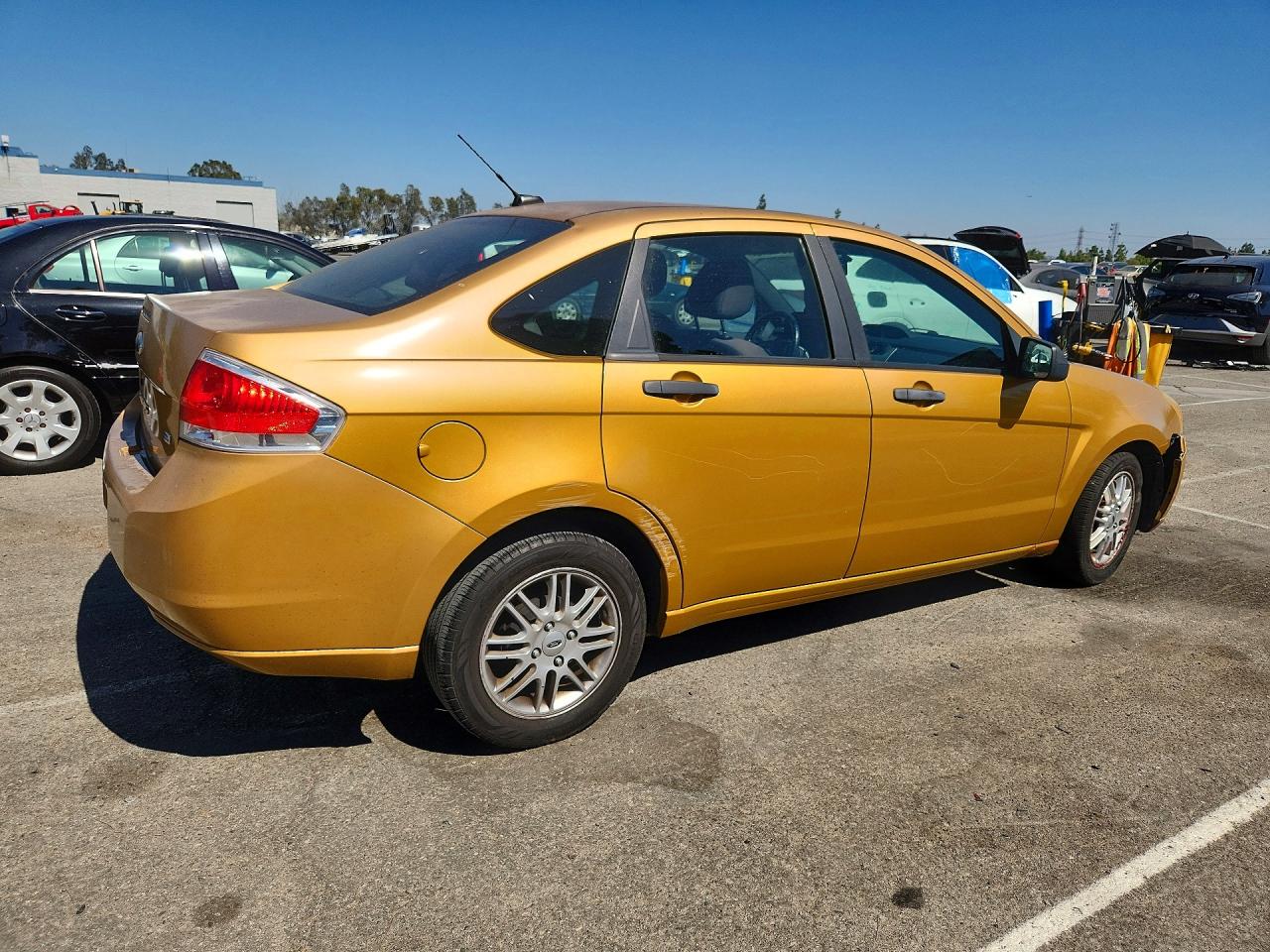 2009 Ford Focus Se Gold vin: 1FAHP35N79W259573