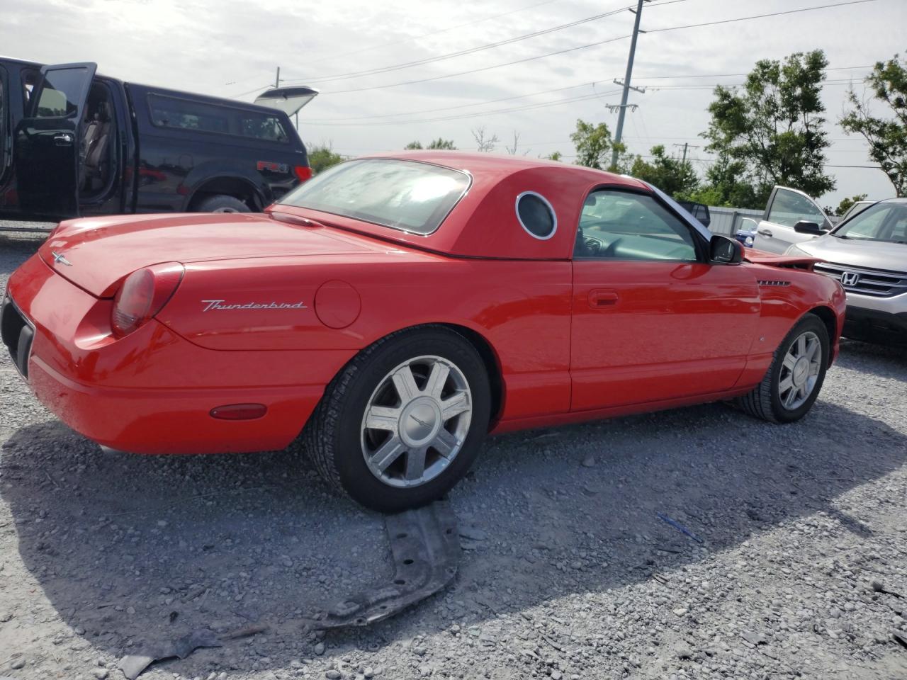 2004 Ford Thunderbird Red vin: 1FAHP60A74Y101463