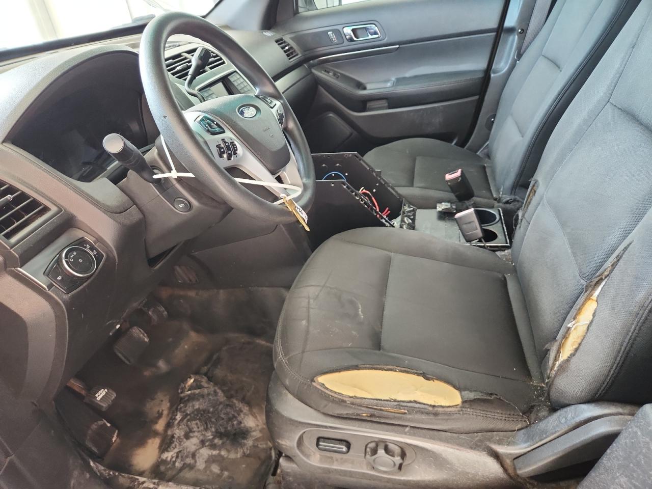 2015 Ford Explorer Police Interceptor White vin: 1FM5K8AR1FGC41640 Damage: Left Front Seat, Torn, > 12 Inches