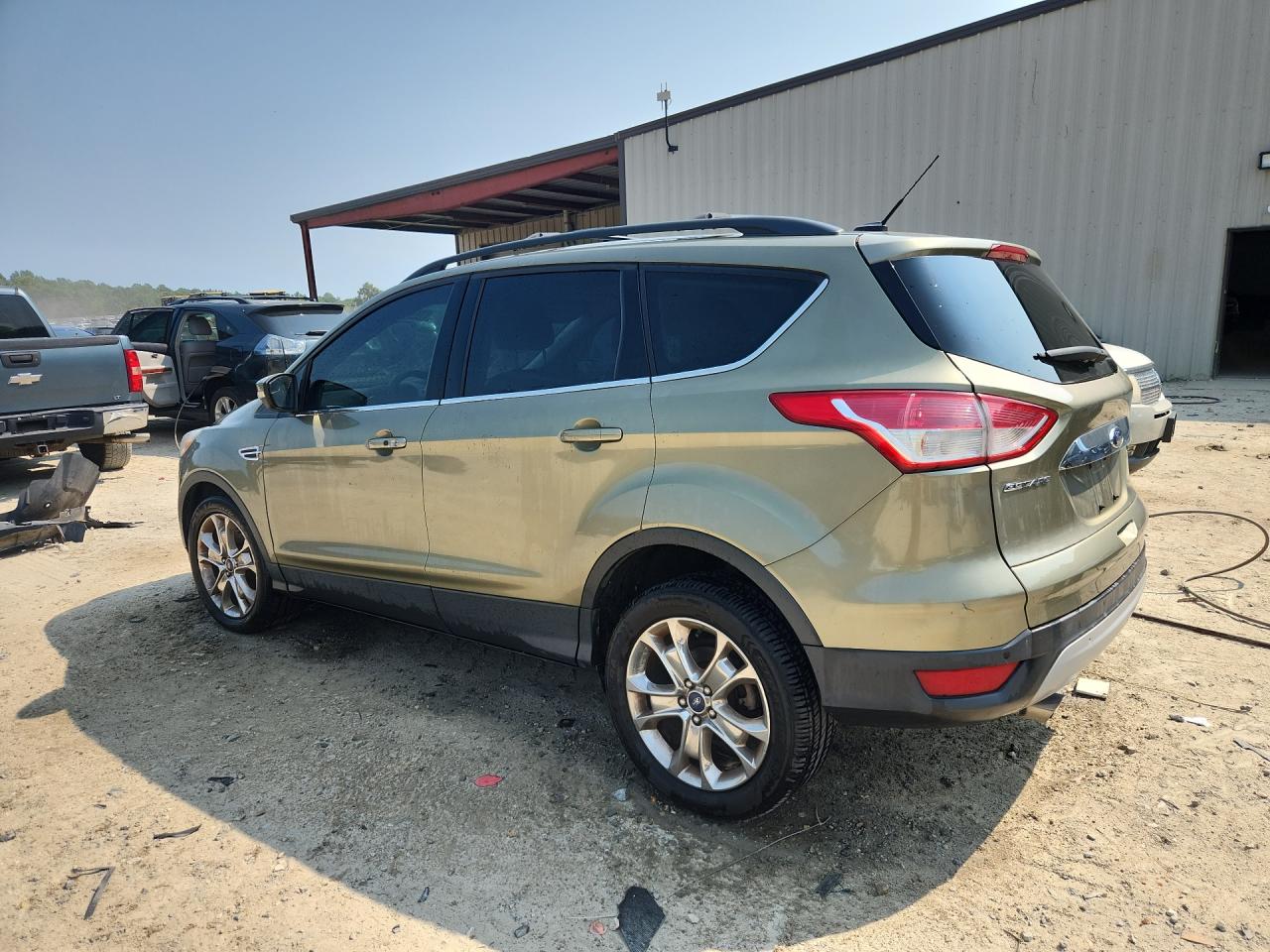2013 Ford Escape Sel Green vin: 1FMCU0H93DUD31895 Damage: Rear Bumper Left Molding, Heavy Scratch, 1/2 To 1 Inch
