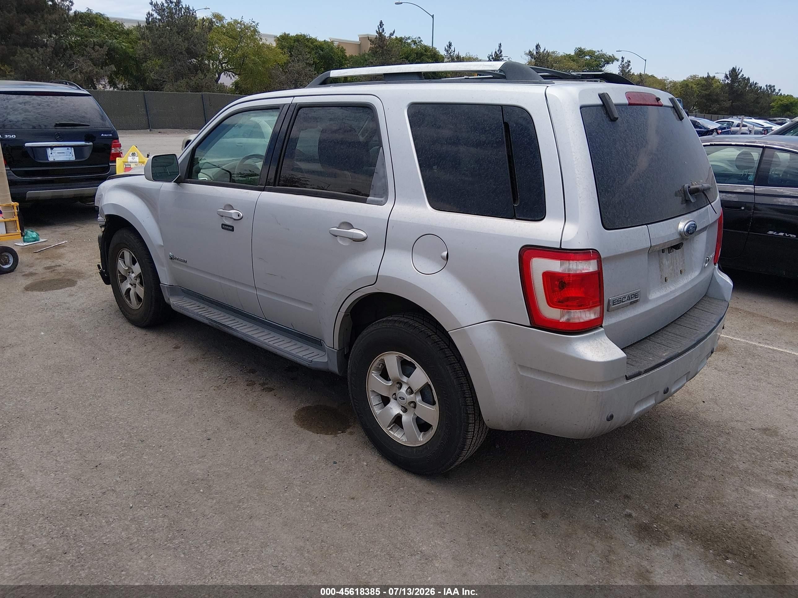 2009 Ford Escape Hybrid Limited Серебряный vin: 1FMCU49369KA07280