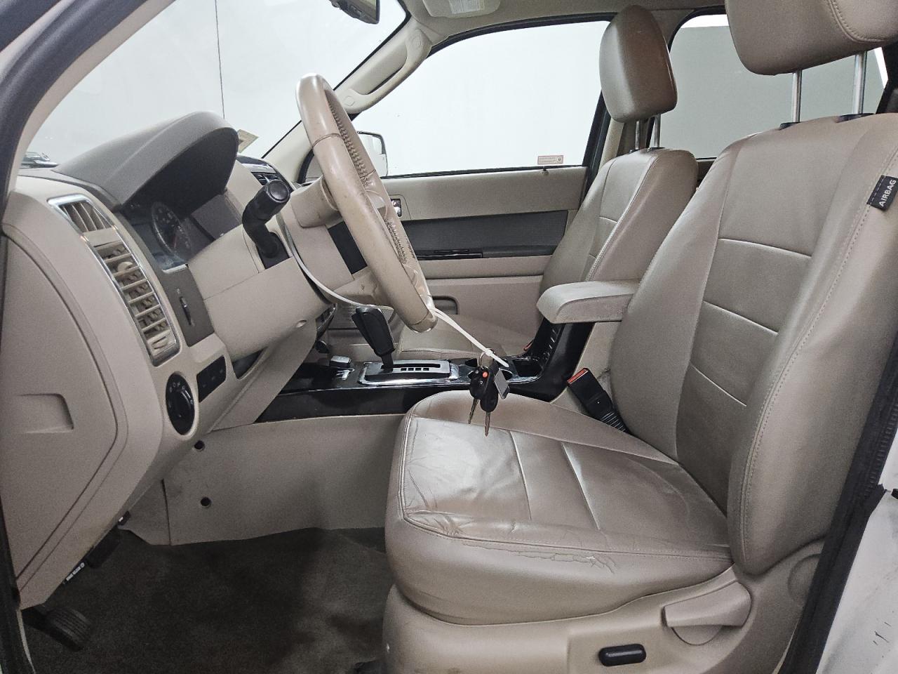 2010 Ford Escape Hybrid White vin: 1FMCU4K39AKC23915 Damage: Left Front Seat Cushion, Torn, > 12 Inches