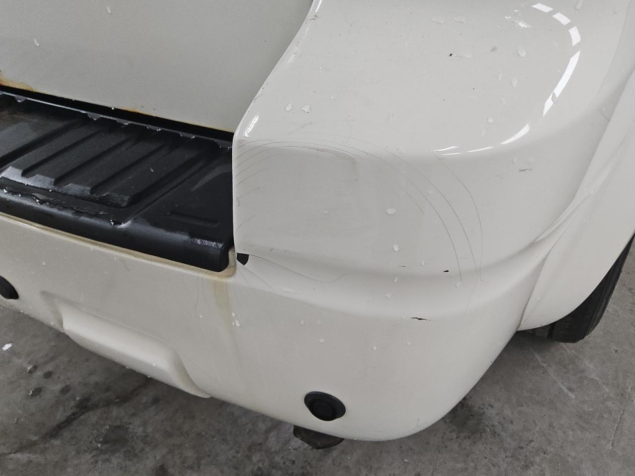 2010 Ford Escape Hybrid White vin: 1FMCU4K39AKC23915 Damage: Rear Bumper, Peeling, 9 To 10 Inches