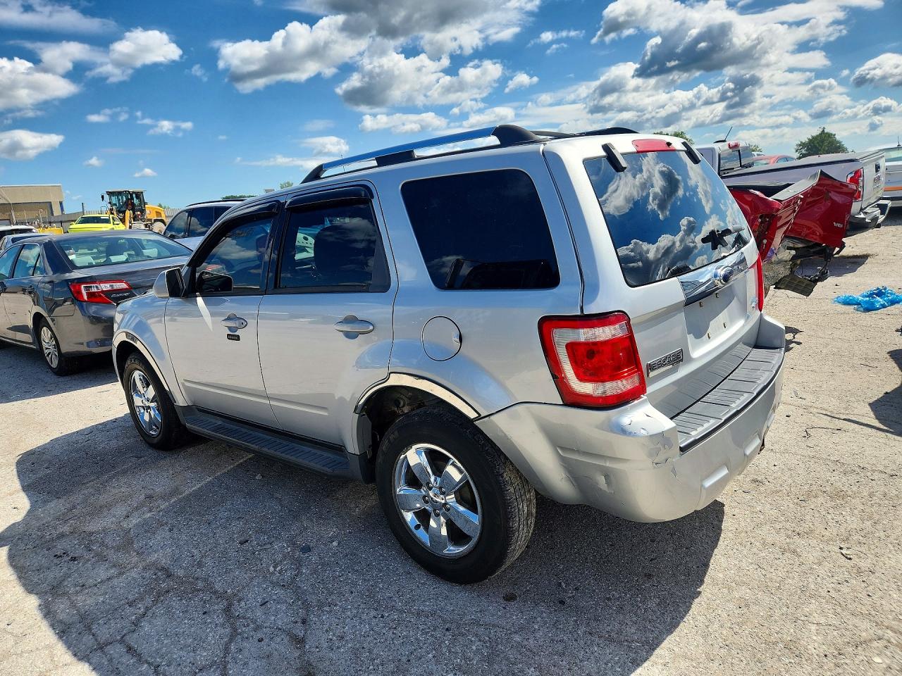 2009 Ford Escape Limited Серебряный vin: 1FMCU94G39KA62342